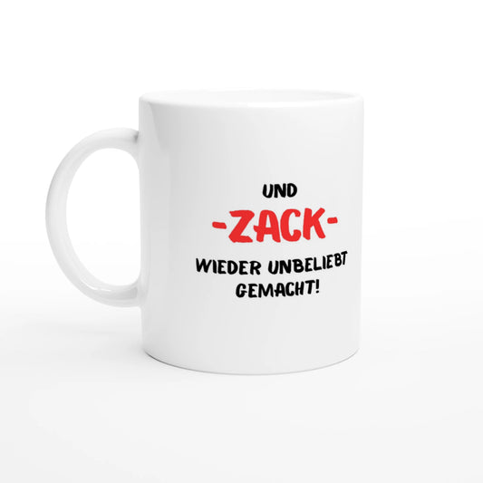 Weiße Keramiktasse 325 ml mit Aufdruck "Und – ZACK – wieder unbeliebt gemacht!" – Schreibtischtasse von Vollzeitfrust, Ansicht von links