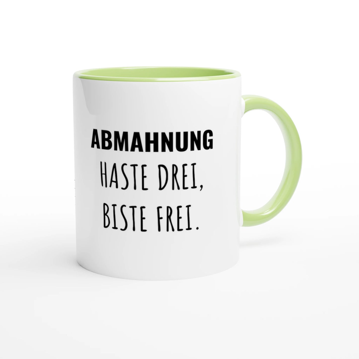 Zweifarbige Keramiktasse 325 ml mit Aufdruck "Abmahnung haste drei, biste frei" in Grün – Schreibtischtasse von Vollzeitfrust