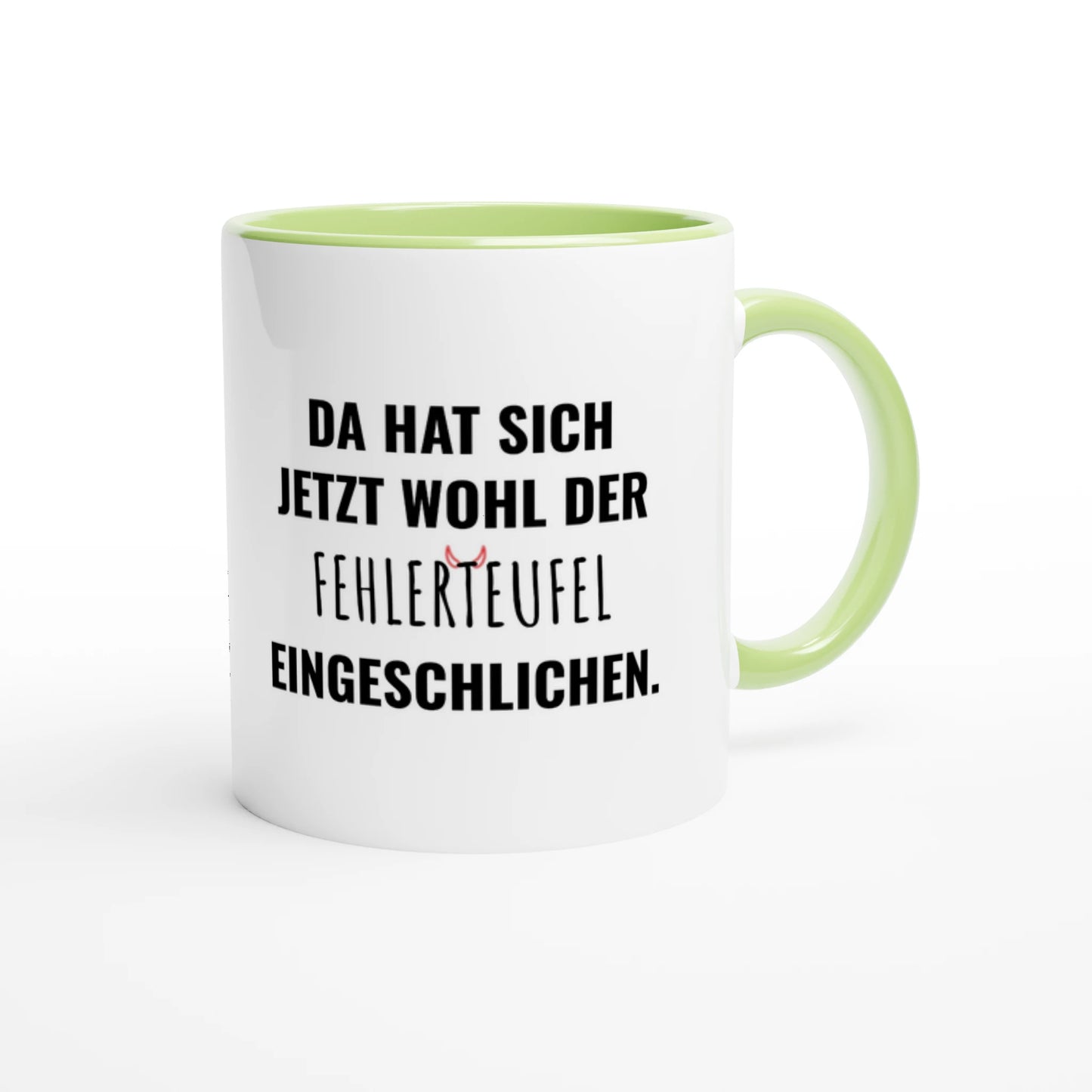 Zweifarbige Keramiktasse 325 ml mit Aufdruck "Da hat sich jetzt wohl der Fehlerteufel eingeschlichen" in Grün – Schreibtischtasse von Vollzeitfrust