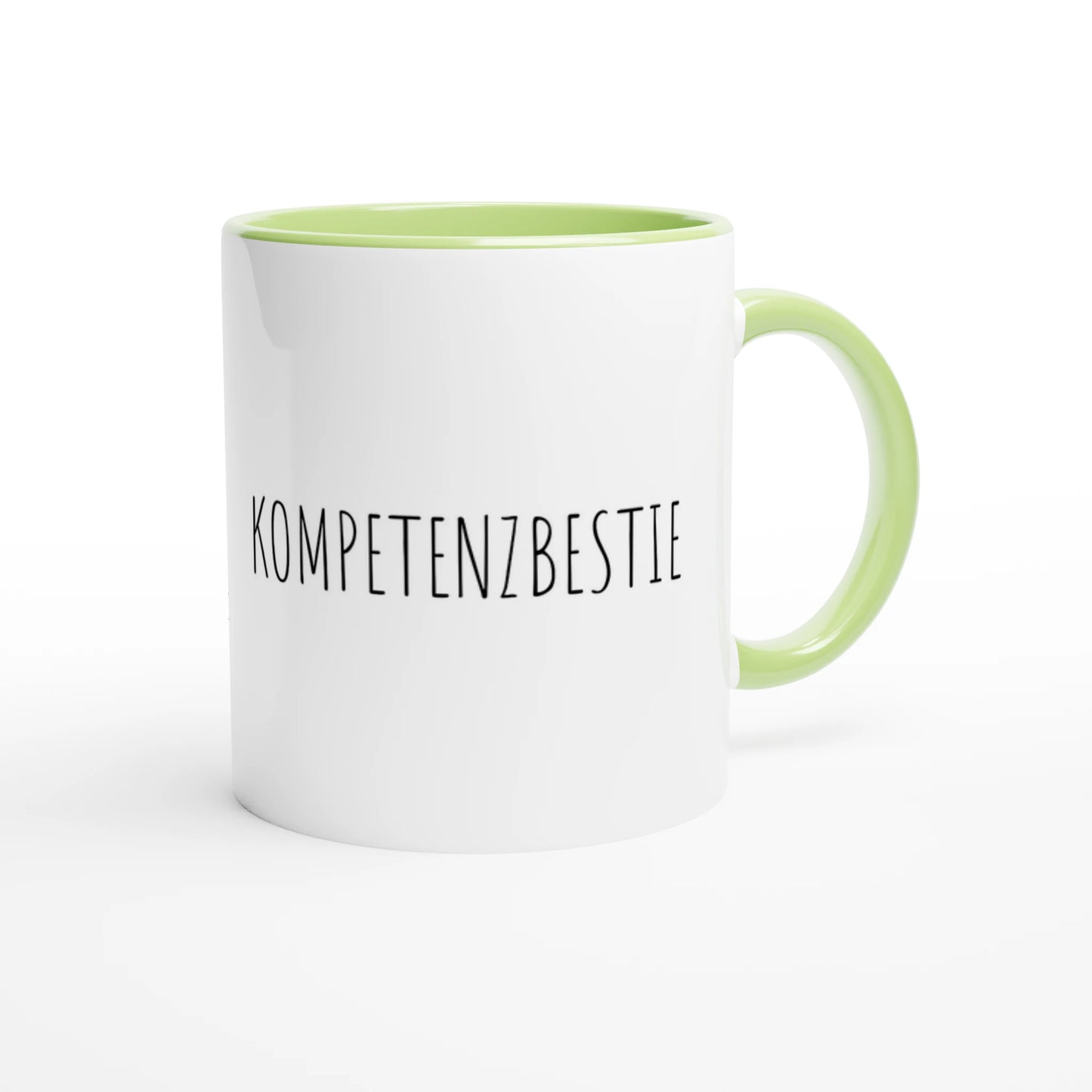 Zweifarbige Keramiktasse 325 ml mit Aufdruck "Kompetenzbestie" in Grün – Schreibtischtasse von Vollzeitfrust
