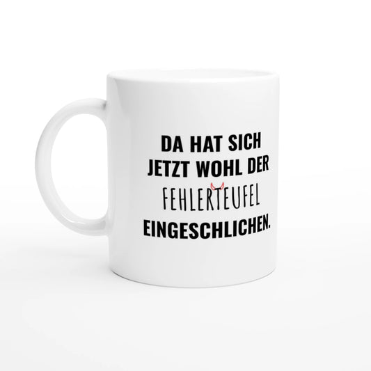Weiße Keramiktasse 325 ml mit Aufdruck "Da hat sich jetzt wohl der Fehlerteufel eingeschlichen" – Schreibtischtasse von Vollzeitfrust, Ansicht von links
