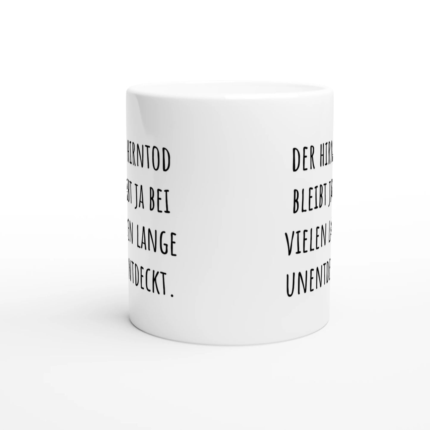 Weiße Keramiktasse mit Aufdruck "Der Hirntod bleibt ja bei vielen lange unentdeckt" – Rundumsicht der Bürotasse von Vollzeitfrust