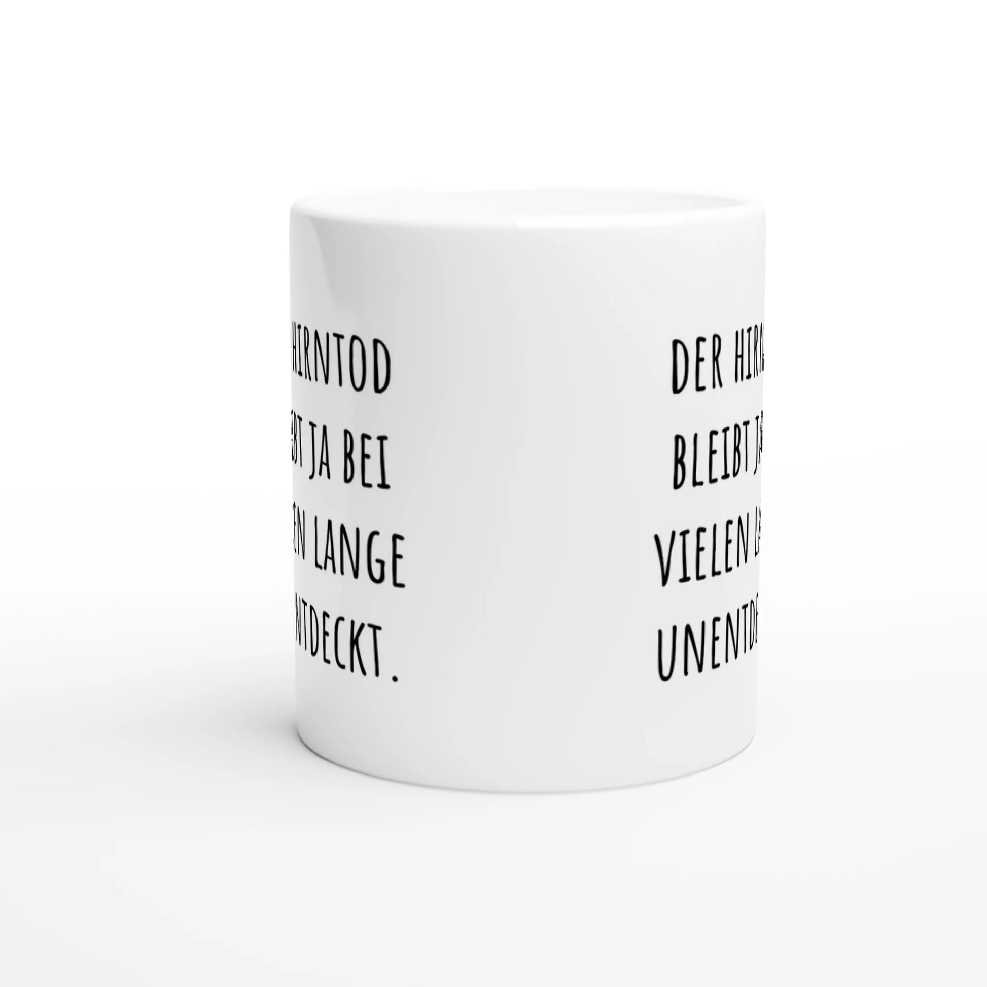 Weiße Keramiktasse mit Aufdruck "Der Hirntod bleibt ja bei vielen lange unentdeckt" – Rundumsicht der Bürotasse von Vollzeitfrust