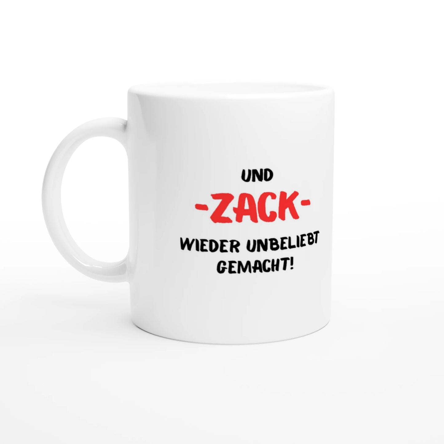 Weiße Keramiktasse 325 ml mit Aufdruck "Und – ZACK – wieder unbeliebt gemacht!" – Schreibtischtasse von Vollzeitfrust, Ansicht von links