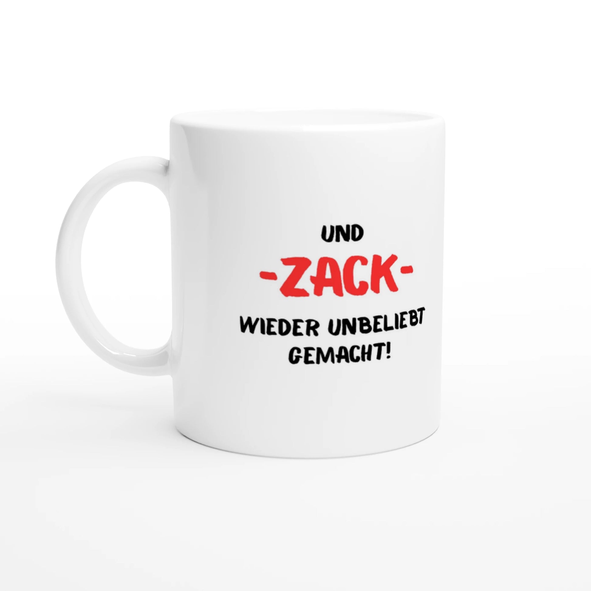 Weiße Keramiktasse 325 ml mit Aufdruck "Und – ZACK – wieder unbeliebt gemacht!" – Schreibtischtasse von Vollzeitfrust, Ansicht von links