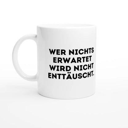 Weiße Keramiktasse 325 ml mit Aufdruck "Wer nichts erwartet wird nicht enttäuscht" – Schreibtischtasse von Vollzeitfrust, Ansicht von links