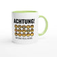 Zweifarbige Keramiktasse 325 ml mit Aufdruck "Achtung! Emotional völlig instabil" in Grün – Schreibtischtasse von Vollzeitfrust
