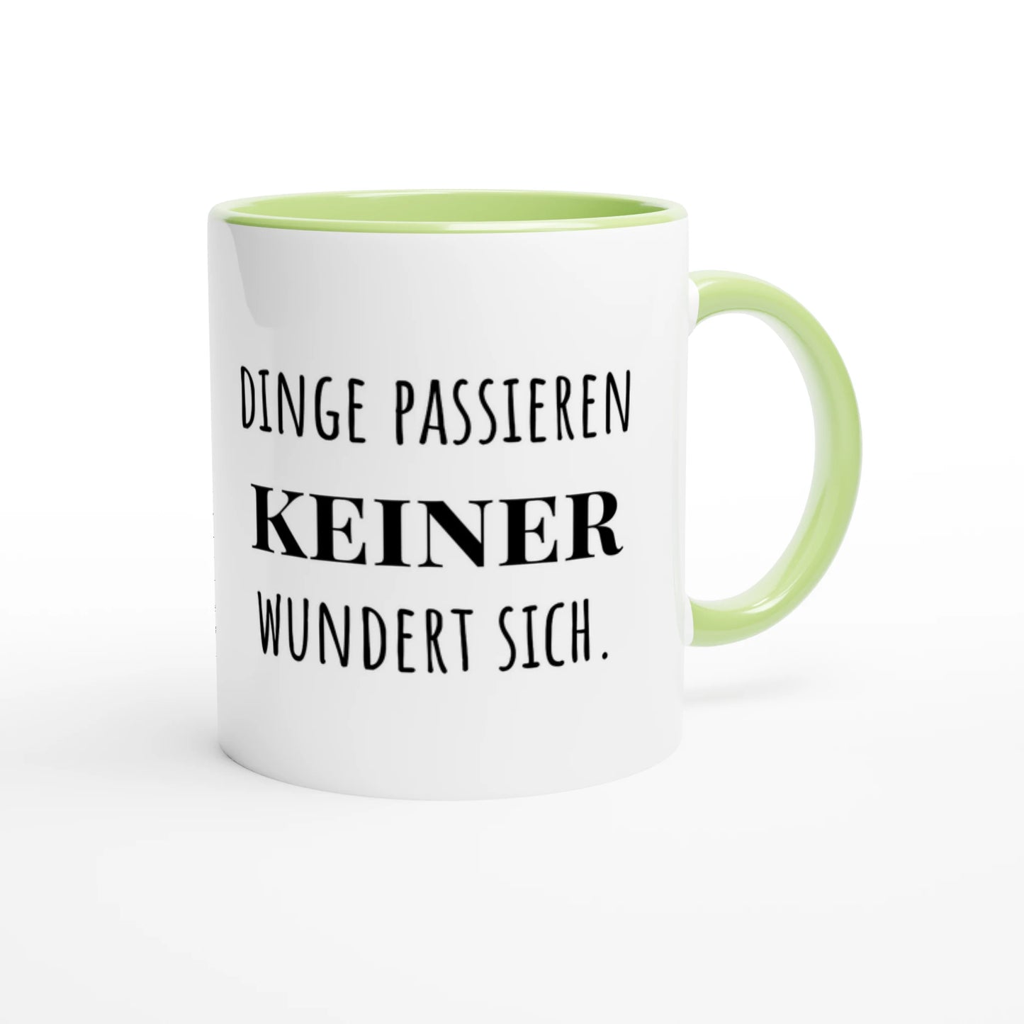 Zweifarbige Keramiktasse 325 ml mit Aufdruck "Dinge passieren. Keiner wundert sich" in Grün – Schreibtischtasse von Vollzeitfrust
