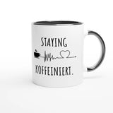 Zweifarbige Keramiktasse 325 ml mit Aufdruck "Staying Koffeiniert" in Schwarz – Schreibtischtasse von Vollzeitfrust
