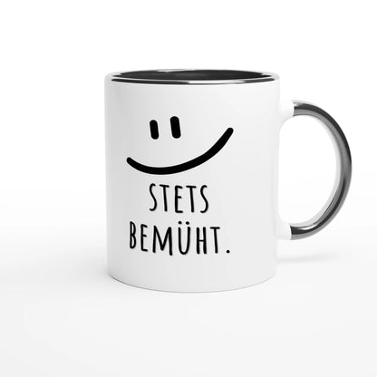 Zweifarbige Keramiktasse 325 ml mit Aufdruck "Stets bemüht" in Schwarz – Schreibtischtasse von Vollzeitfrust
